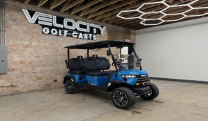 Coastal Blue Voyager Commander 4 seater forward-facing golf cart with black seats and Eco lithium battery, lifted with independent suspension and four-wheel disc brakes at Velocity Golf Carts in Salt Lake City, Utah
