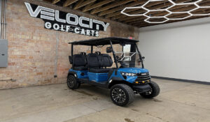 Riptide Blue Voyager Commander 4 seater forward-facing golf cart with black seats and Eco lithium battery, lifted with independent suspension and four-wheel disc brakes at Velocity Golf Carts in Salt Lake City, Utah