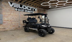 Night Sky Black Voyager Patriot 4 passenger golf cart with black seats, 72-volt Eco lithium battery, independent suspension, four-wheel disc brakes, lifted suspension, Apple CarPlay, and aluminum frame at Velocity Golf Carts in Salt Lake City, Utah