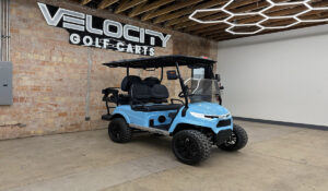 Blue Skies Voyager Patriot 4 passenger golf cart with black seats, 72-volt Eco lithium battery, independent suspension, four-wheel disc brakes, lifted suspension, Apple CarPlay, and aluminum frame at Velocity Golf Carts in Salt Lake City, Utah