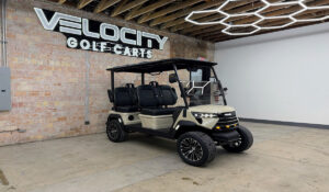 Sandy Shore Voyager Commander 4 seater forward-facing golf cart with black seats and Eco lithium battery, lifted with independent suspension and four-wheel disc brakes at Velocity Golf Carts in Salt Lake City, Utah